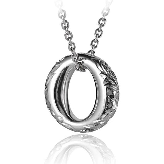 Oval and circle pendant necklace featuring scroll details, crafted by Ashley's Gift Shop, displayed against a neutral background.
