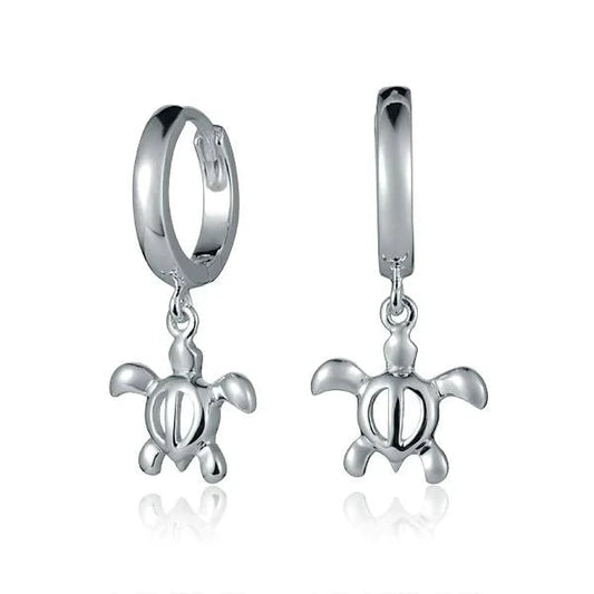 Sterling silver hoop earrings with dangling Honu turtle charms, crafted by Ashley's Gift Shop.