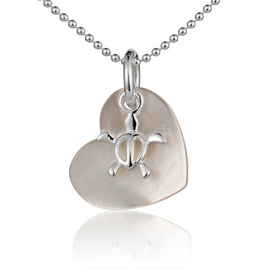 Small honu pendant with a shell heart design, featuring a carved turtle motif, ideal for Hawaiian-inspired jewelry.