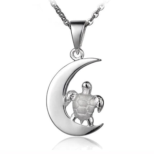 Shiny crest moon turtle pendant featuring a detailed turtle design with a crescent moon, crafted by Ashley's Gift Shop.