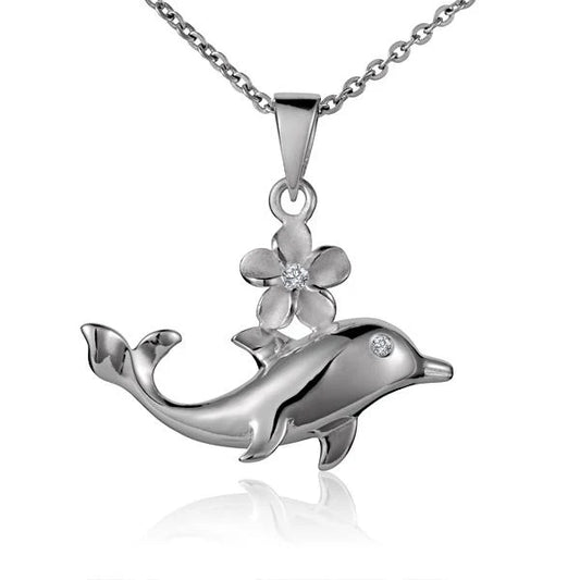 Shiny dolphin pendant with an 8mm flower design, crafted by Ashley's Gift Shop, displayed on a jewelry stand.