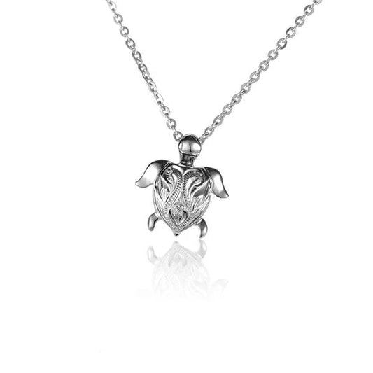 Small turtle scroll pendant featuring intricate carved design, crafted by Ashley's Gift Shop, ideal as a delicate jewelry piece.