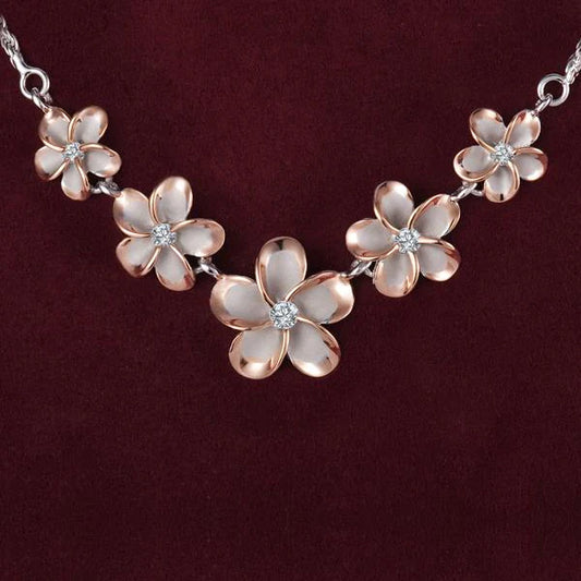 Sterling silver Rhoidum Plumeria 2T PG rope necklace with 10-15mm beads, featuring detailed floral design and polished finish.