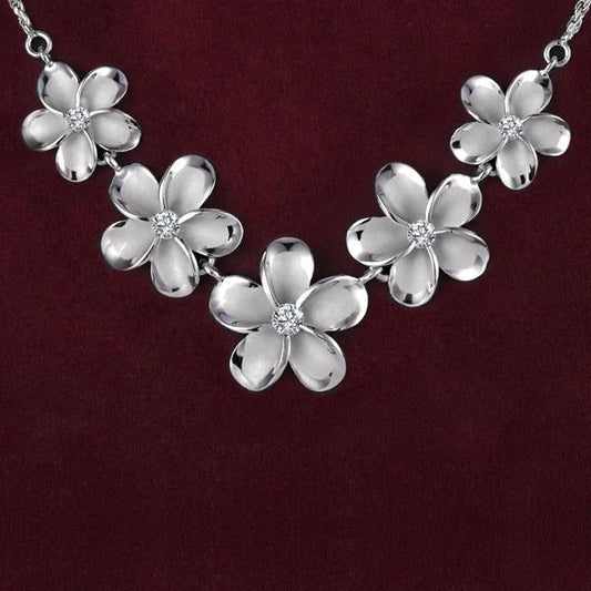 Sterling silver Plumeria Rhodium Rope Necklace with 15-20mm chain, featuring detailed floral design and polished finish.