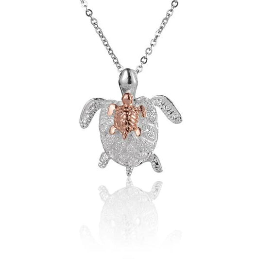 Silver turtle pendant featuring a mother and baby turtle design, ideal for mom and baby jewelry, by Ashley's Gift Shop.