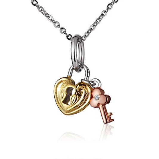 Small Ashley's Gift Shop SP Scroll Heart with Key Pendant featuring intricate heart and key design.