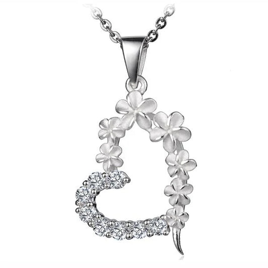 Sterling silver Plumeria Heart Pendant featuring a delicate floral design, crafted in 925 sterling silver.