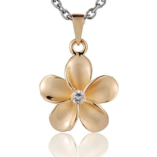 Sterling silver Plumeria CZ pendant, 18mm, with yellow gold plating, featuring a floral design and sparkling cubic zirconia stones.