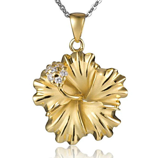 Sterling silver Hibiscus CZ pendant, 25mm, featuring yellow gold accents, showcasing intricate floral design and sparkling gemstones.