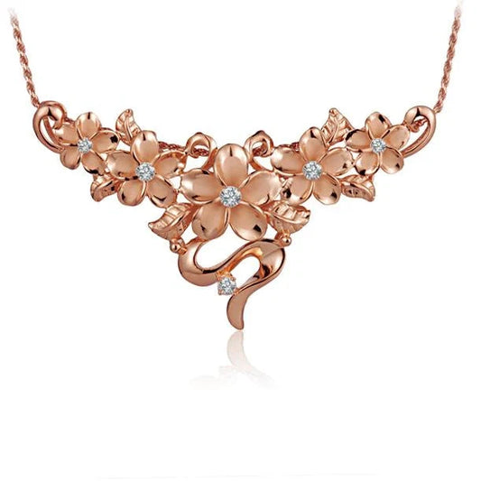 Sterling silver Plumeria CZ pendant with PG plating, featuring a floral design, 5 inches long, from Ashley's Gift Shop.