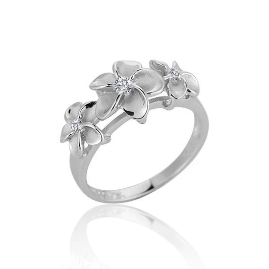 Sterling silver Plumeria CZ ring with 8/10/8mm stones, rhodium finish, featuring intricate floral design, crafted by Ashley's Gift Shop