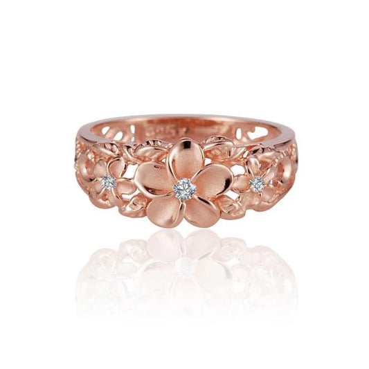 Sterling silver Plumeria Scroll CZ ring with platinum plating, featuring intricate floral design and sparkling cubic zirconia accents.