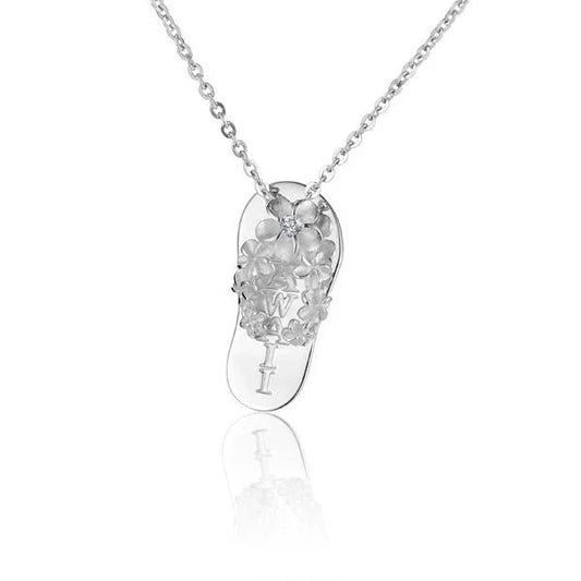 Sterling silver Plumeria Hawaii slipper pendant featuring intricate flower design, crafted by Ashley's Gift Shop.