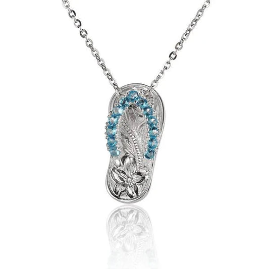 Sterling silver slipper pendant with blue scroll design, 13CZ accent, crafted by Ashley's Gift Shop.