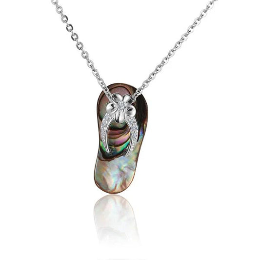 Sterling silver Plumeria 7CZ Shell Slipper Pendant with floral design, showcasing sparkling cubic zirconia stones.