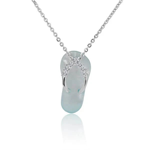Hawaiian 925 Sterling Silver plumeria 7CZ shell slipper pendant with cubic zirconia accents.