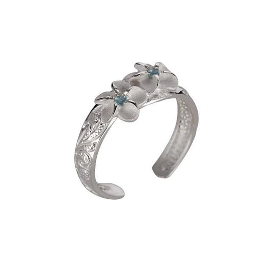 Sterling silver Plumeria Scroll CZ toe ring featuring floral design and sparkling cubic zirconia accents.