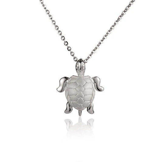 Small turtle pendant necklace in silver with detailed shell design, from Ashley's Gift Shop.