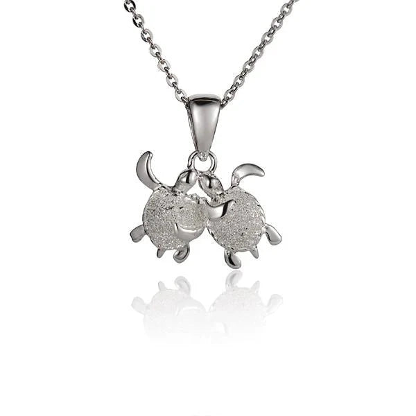 Hawaiian 925 Sterling Silver twin turtle pendant, featuring detailed turtle designs on a polished necklace.