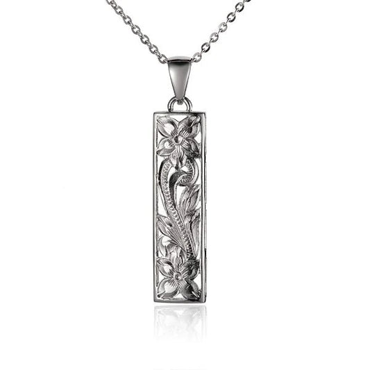 Vertical S/T scroll pendant in 10mm, featuring intricate metalwork, crafted by Ashley's Gift Shop.