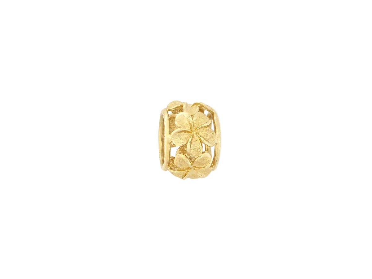 Hawaiian 14K Gold plumeria spinner pendant featuring a delicate floral design.